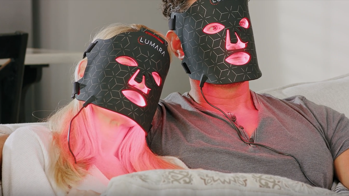 Lumara Viso LED light therapy mask illuminated showing full facial coverage red light treatment design