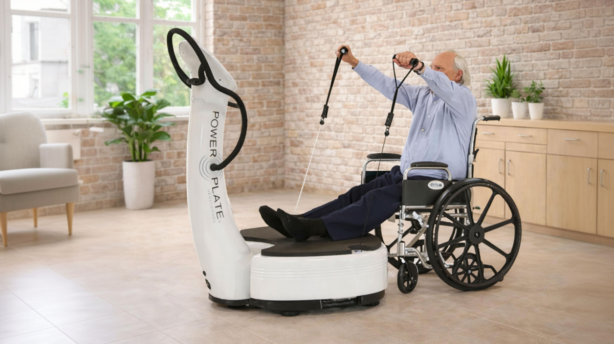 Power Plate pro7HC healthcare vibration platform wheelchair patient performing resistance cable rehabilitation exercise in therapy clinic