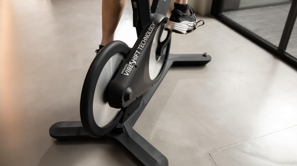 Close up of Power Plate REV bike VibeShift Technology drive system and flywheel housing