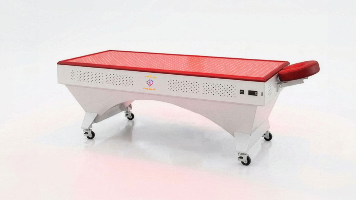 Prestige Pro Modular Red Light Therapy Bed lower panel base unit shown without the overhead panel, featuring the wheeled bed structure, red light surface, and adjustable headrest.