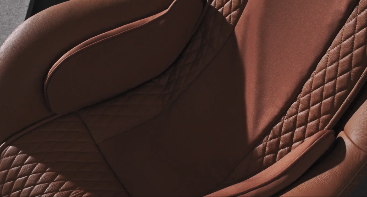 Close-up of a Ceragem pause M4 brown saddle with quilted pattern