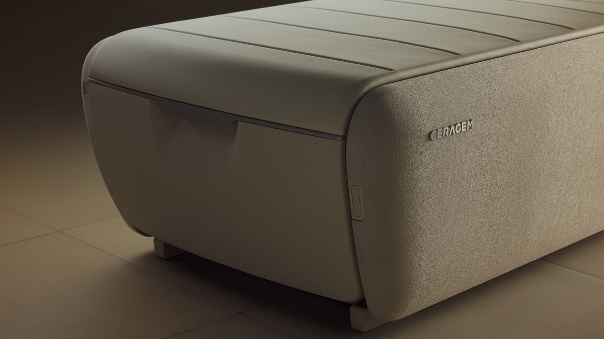 Ceragem Master V9 massage bed front base showing integrated storage and structural design in beige finish