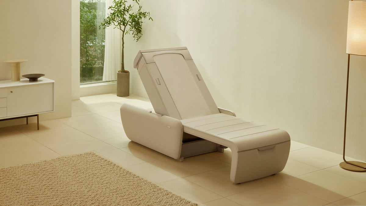 Ceragem Master V9 massage bed in reclined position placed in modern home setting with clean minimalist interior