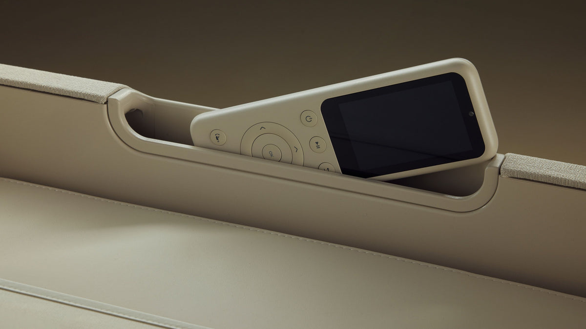 Ceragem Master V9 massage bed remote controller stored in side compartment for easy access and control