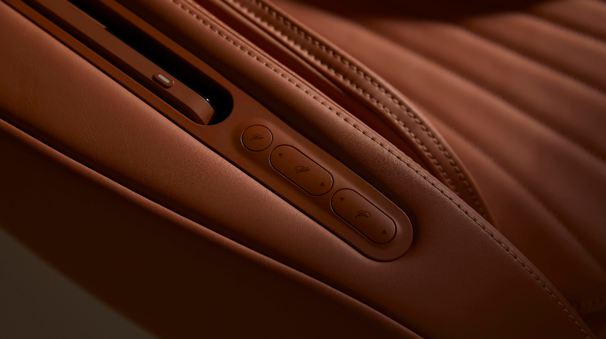 Ceragem Pause M6 massage chair control panel buttons close up on armrest