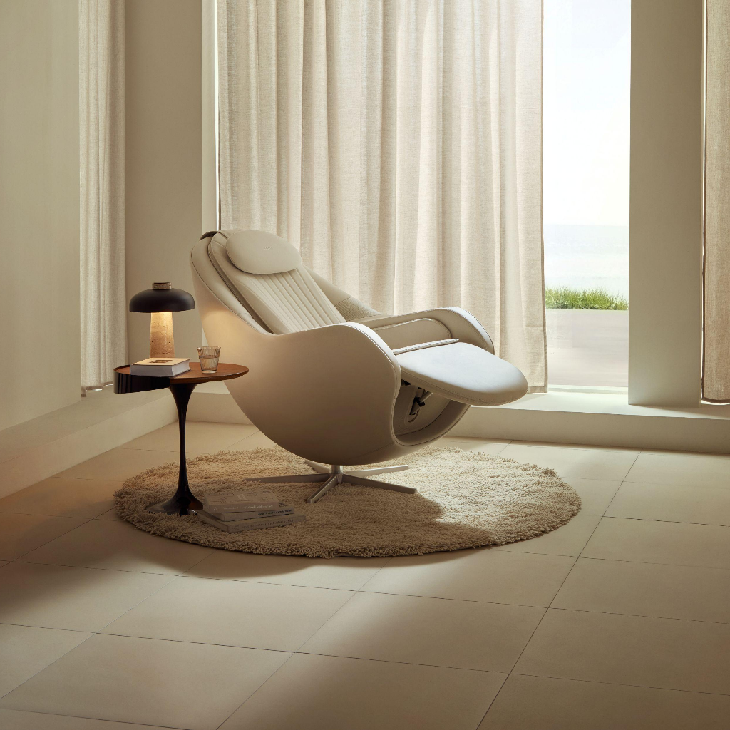Ceragem Pause M6 massage chair in reclined position near bright window in calm home environment