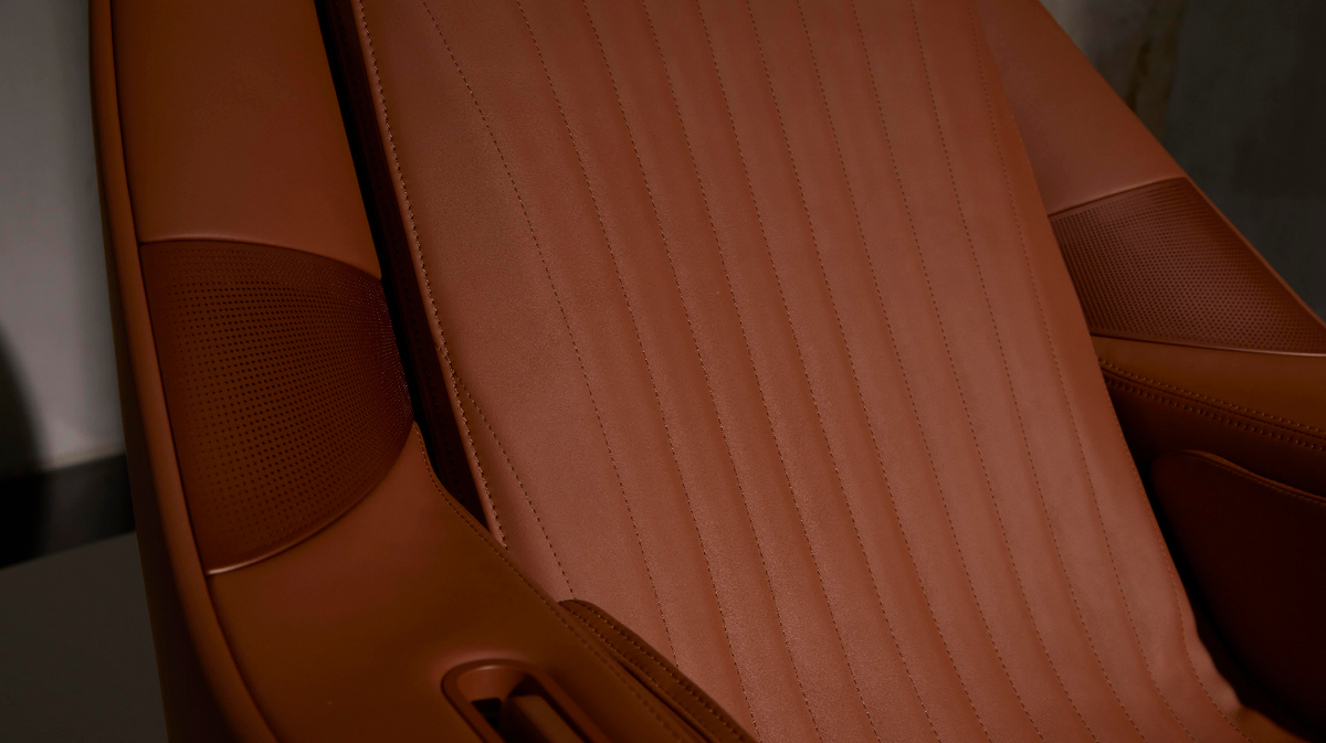 Ceragem Pause M6 massage chair upholstery detail showing stitched seat surface and material texture