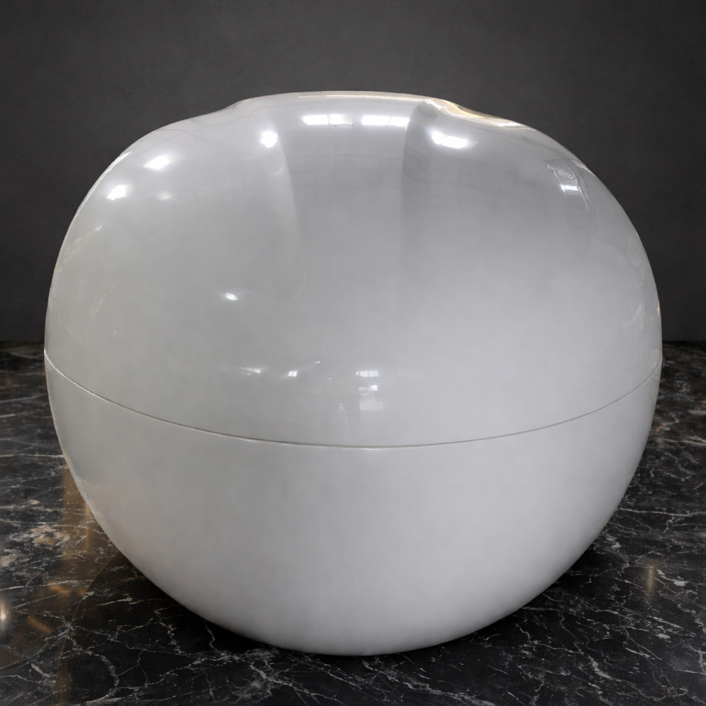 Dreampod Home Float Plus float tank closed pod showing glossy fiberglass shell on dark marble surface; end view.