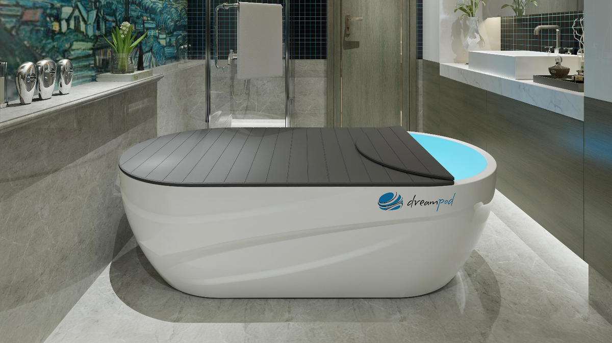 Dreampod Home Float Pro float tank in residential bathroom with partial lid cover and illuminated interior water