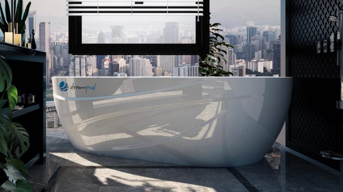 Dreampod Mineral Soaker heated mineral bath system in modern bathroom with large window and city skyline view