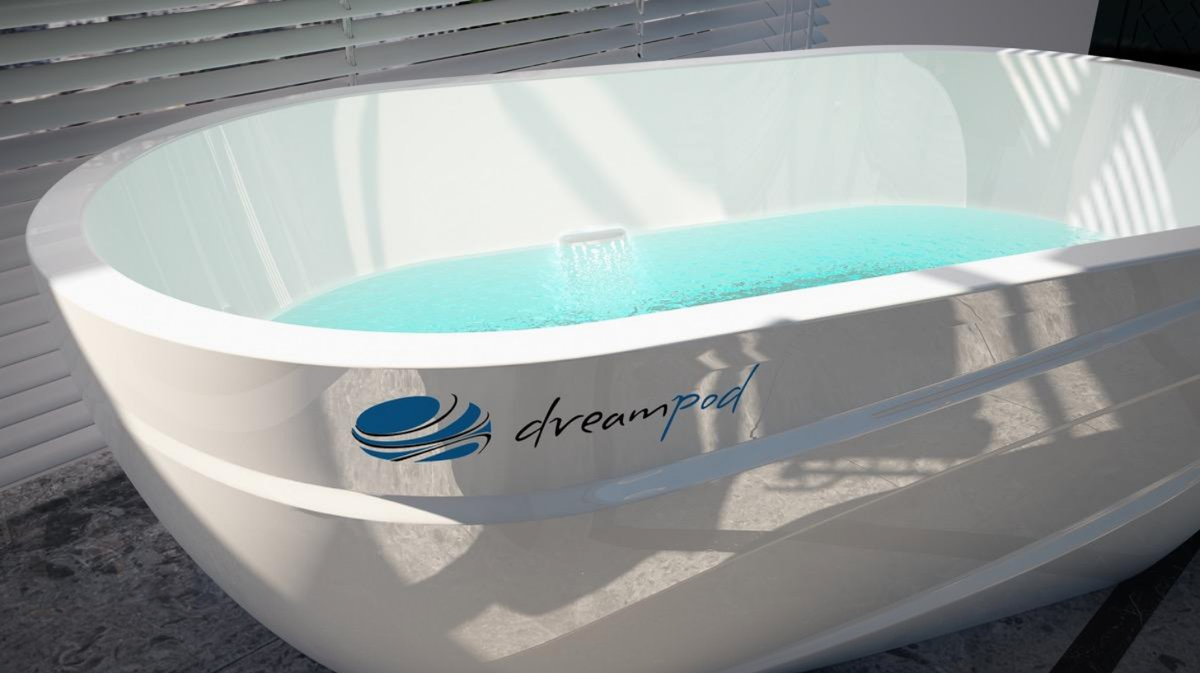 Dreampod Mineral Soaker mineral bath system interior showing water fill and smooth high-gloss soaking surface