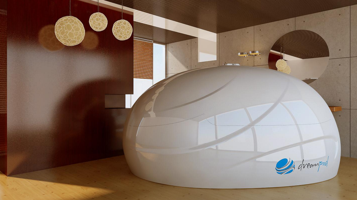 Dreampod V2 float pod commercial float tank positioned inside modern wellness room with ambient lighting