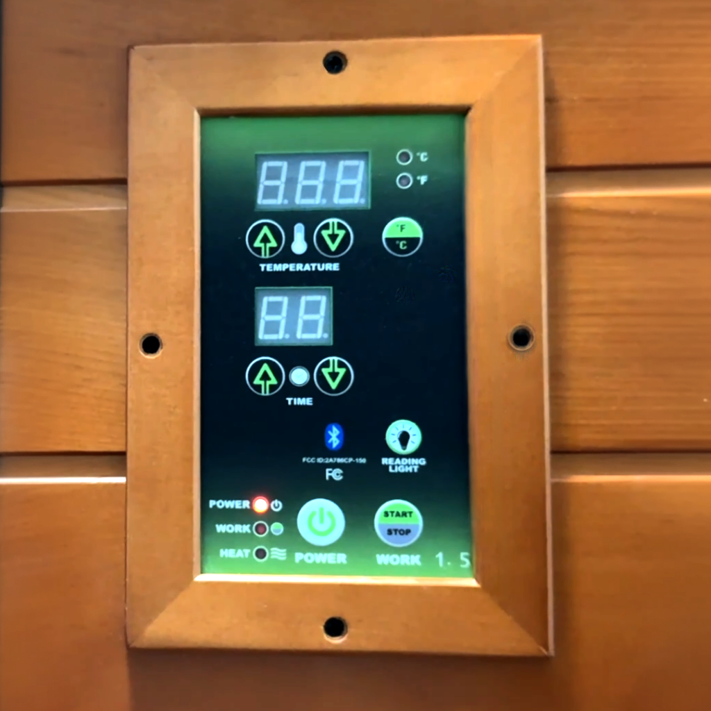 Dynamic Barcelona infrared sauna digital control panel displaying temperature time and Bluetooth controls inside sauna