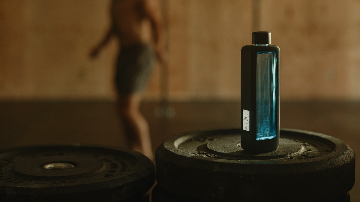Echo Flask hydrogen water bottle placed on gym equipment in performance and recovery training environment