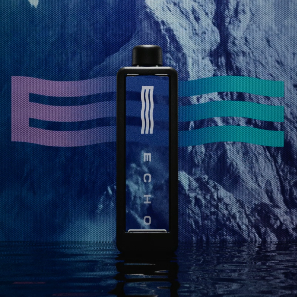 Echo Flask hydrogen water bottle standing upright in reflective water with branded background in studio environment