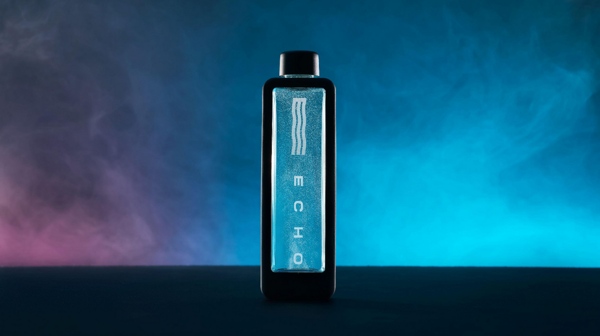 Echo Flask hydrogen water bottle displayed upright in clean studio gradient environment with illuminated hydrogen chamber