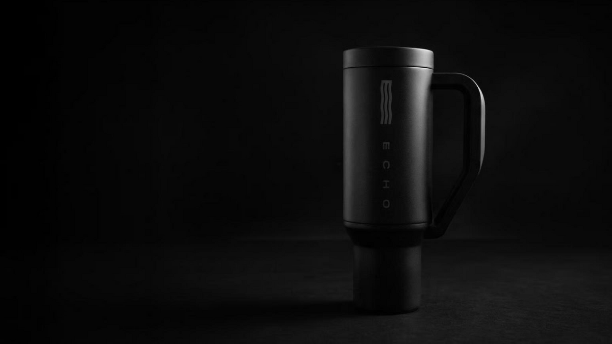 Echo Forty hydrogen water tumbler in dark studio setting emphasizing premium build stainless steel construction and portable hydrogen generation system
