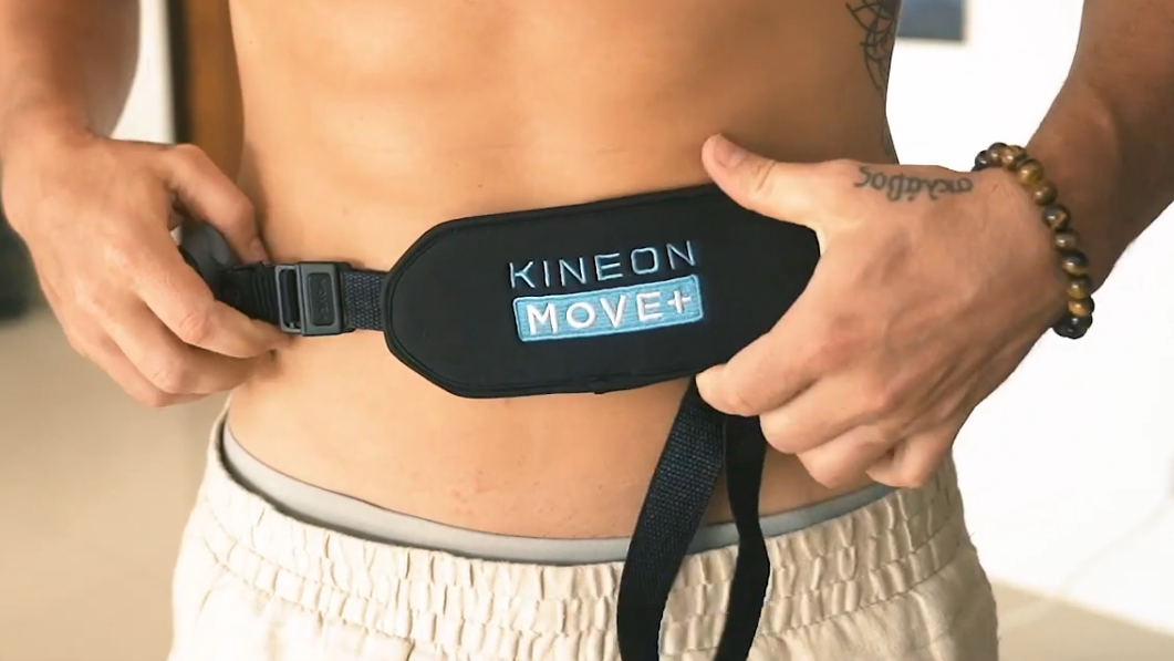 Kineon Move+ extender strap adjustable wrap securing red light therapy device around lower back front closure