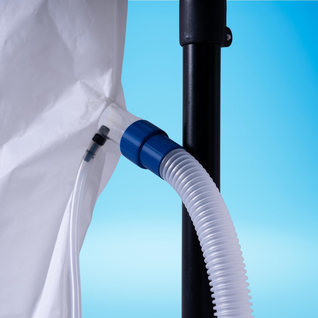 LiveO2 Adaptive Contrast EWOT system reservoir close-up showing the ribbed breathing hose and side connection port on a blue studio background