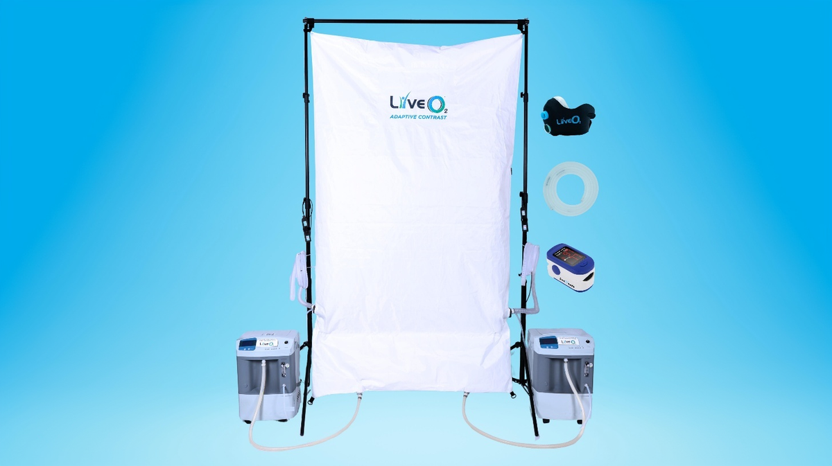 LiveO2 Dual-User Adaptive Contrast EWOT system components layout showing Dual AC reservoir, dual air separators, mask, tubing, and pulse oximeter