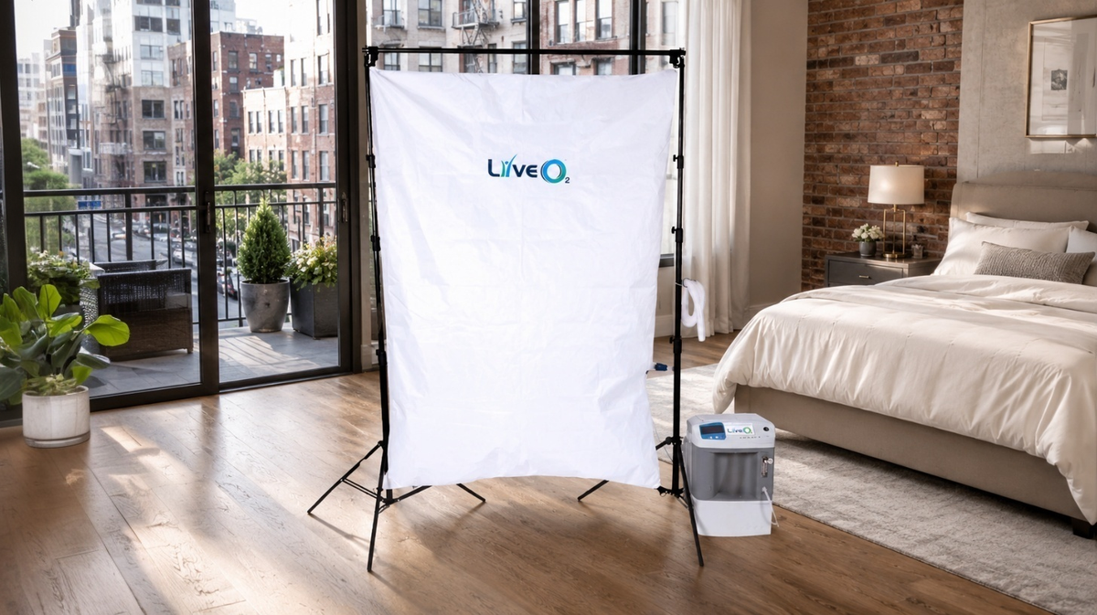 LiveO2 EWOT Oxygen Training System for home use with reservoir, 10 LPM air separator, tubing, and frame kit in a bedroom loft setting