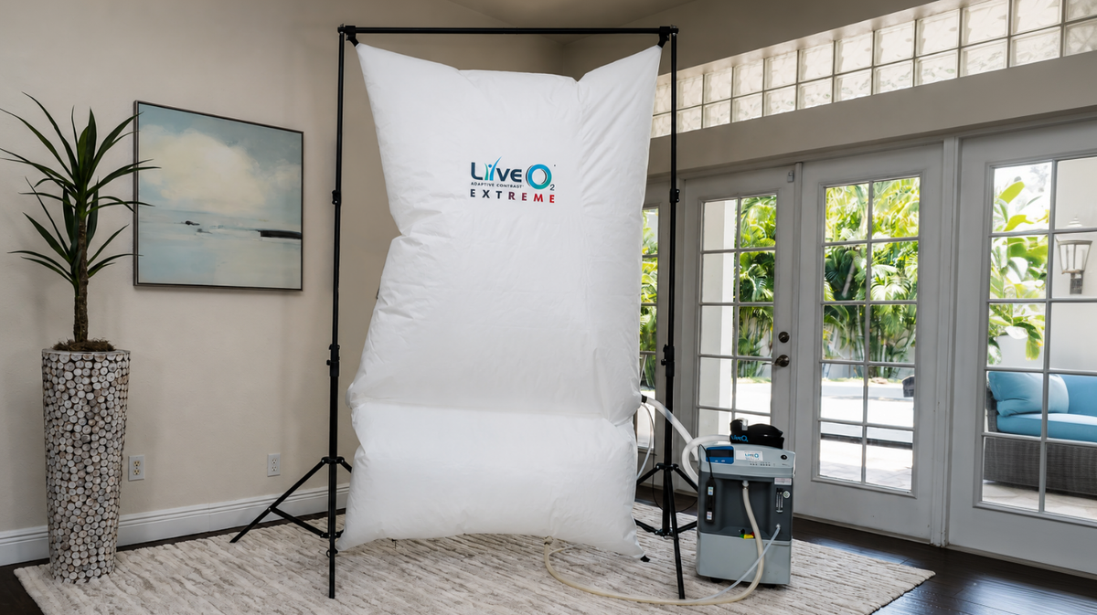 LiveO2 Extreme adaptive contrast EWOT system set up in home wellness room with reservoir, frame kit, and air separator