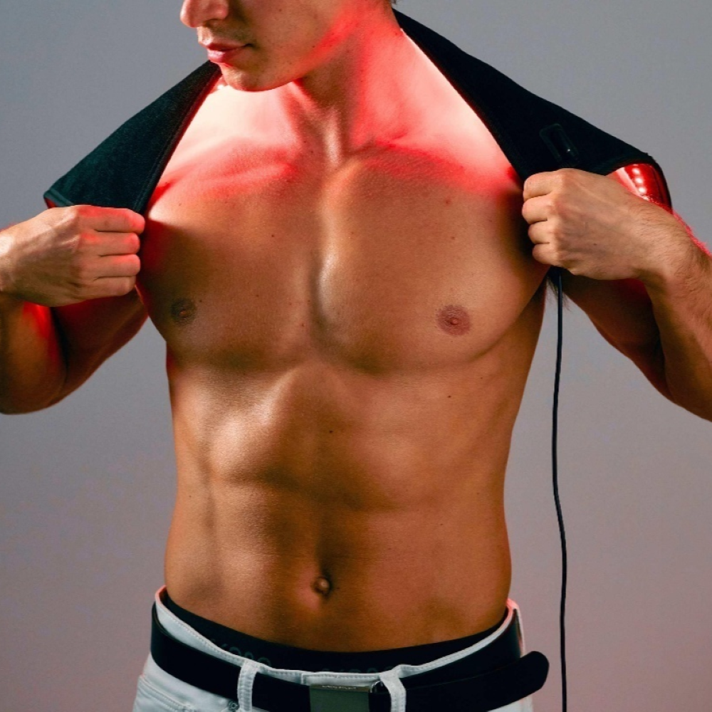 Lumara red light therapy pad wrapped across shoulders and neck showing flexible design for upper body application