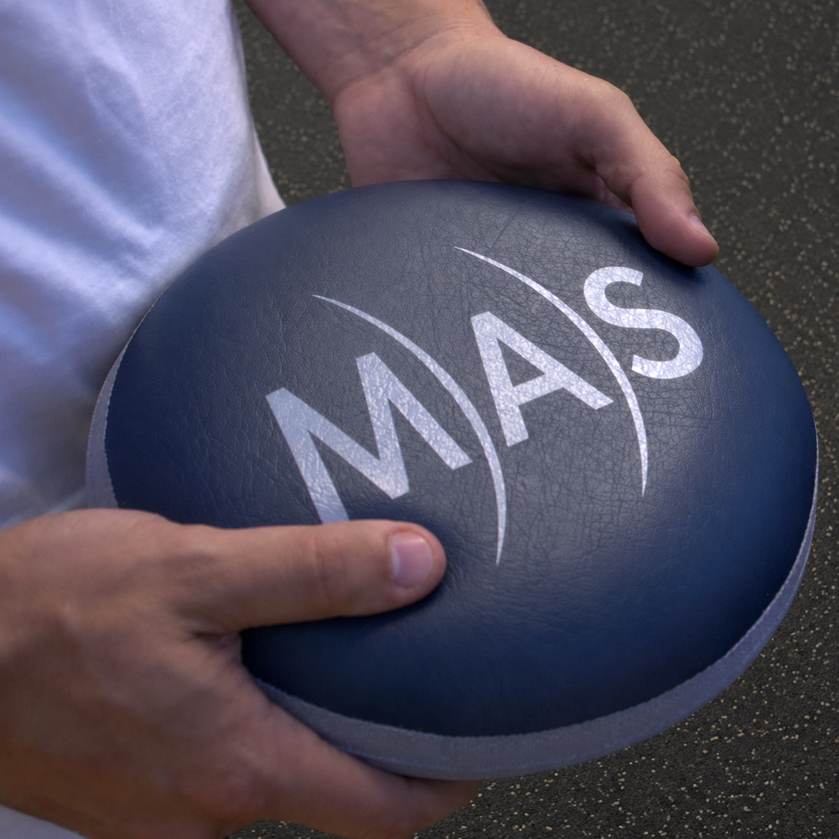MAS analog PEMF pillow applicator held in hands for targeted pulsed electromagnetic field wellness and recovery sessions
