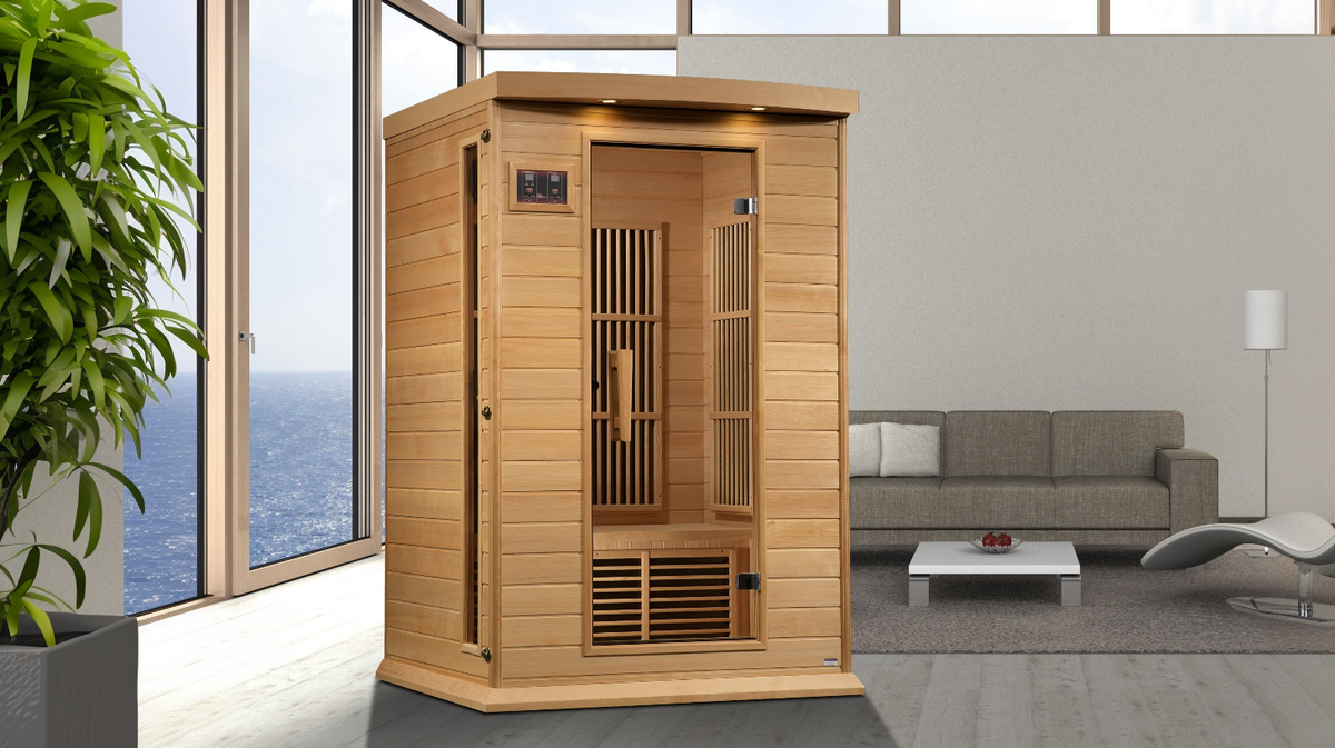 Maxxus Toulouse 2 person infrared sauna placed in modern living room setting with large windows and indoor wellness environment