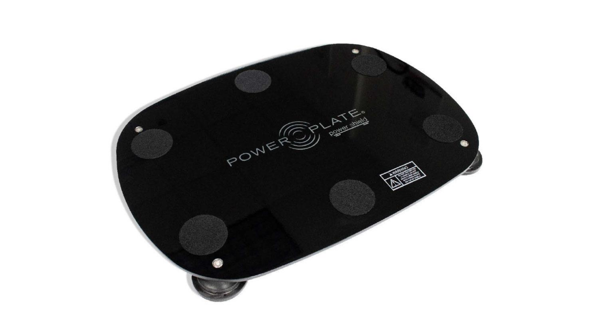 Personal Power Plate Power Shield vibration reduction platform designed to sit beneath the Personal Power Plate vibration trainer to help absorb residual vibration and reduce floor vibration transfer during whole body vibration training sessions.