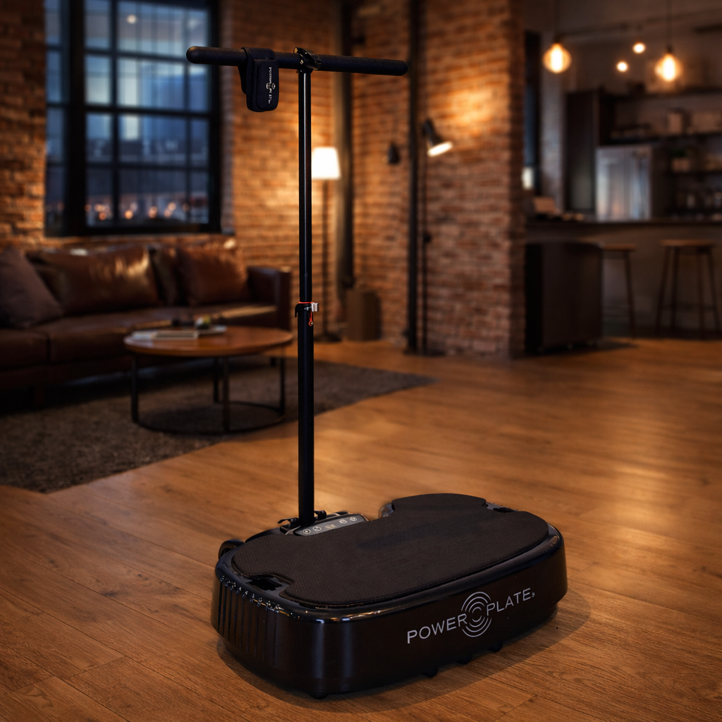 Personal Power Plate Stability Bar mounted to the Personal Power Plate vibration platform providing upright balance support for standing exercises and mobility training