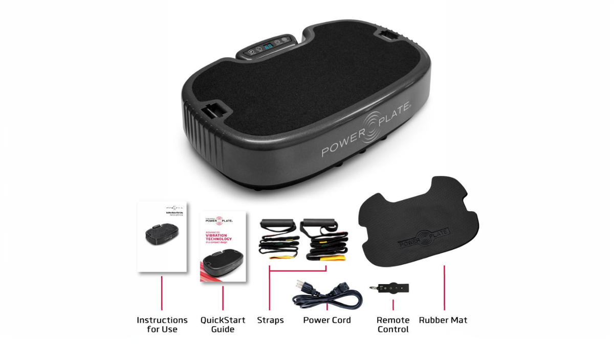 Personal Power Plate vibration platform with included straps, remote control, rubber mat, power cord, and instruction materials for whole body vibration training.