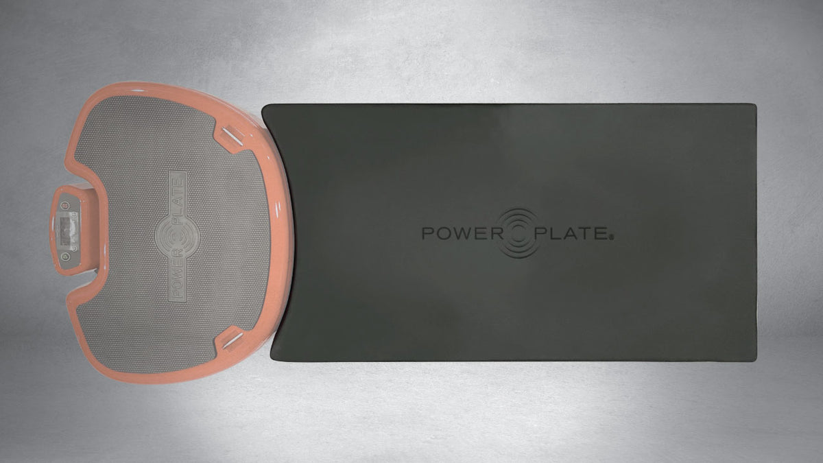 Top view comparison of Power Plate Deluxe Support Cushion positioned next to vibration platform showing extended support surface for exercises
