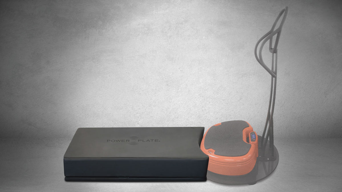 Power Plate Deluxe Support Cushion shown with vibration platform demonstrating compatibility and positioning for supported exercises