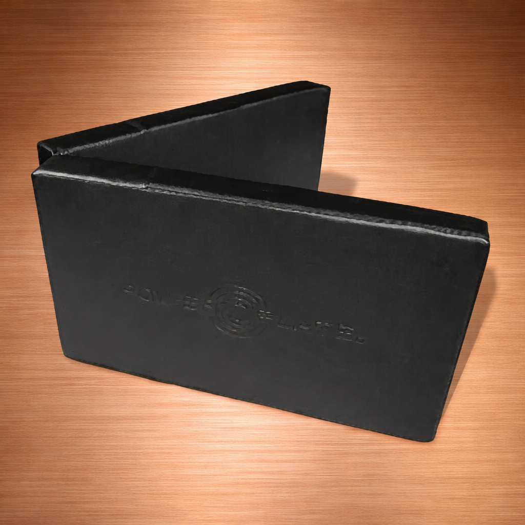 Power Plate Folding Support Cushion shown partially folded to demonstrate the elevated support configuration used to align the body with the height of the Personal Power Plate during vibration massage and recovery positioning.