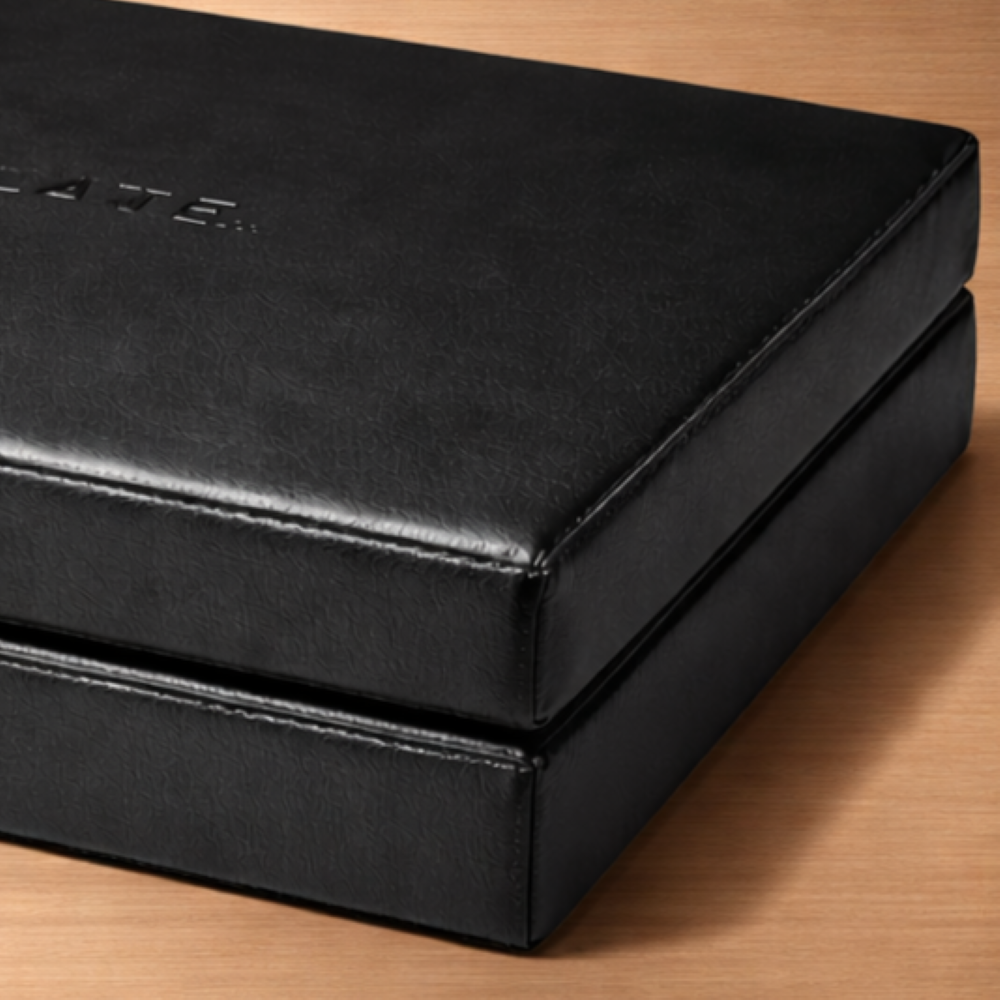 Close-up view of the padded surface of the Power Plate Folding Support Cushion showing the durable wipe-clean material designed for repeated use during Personal Power Plate massage and recovery sessions.