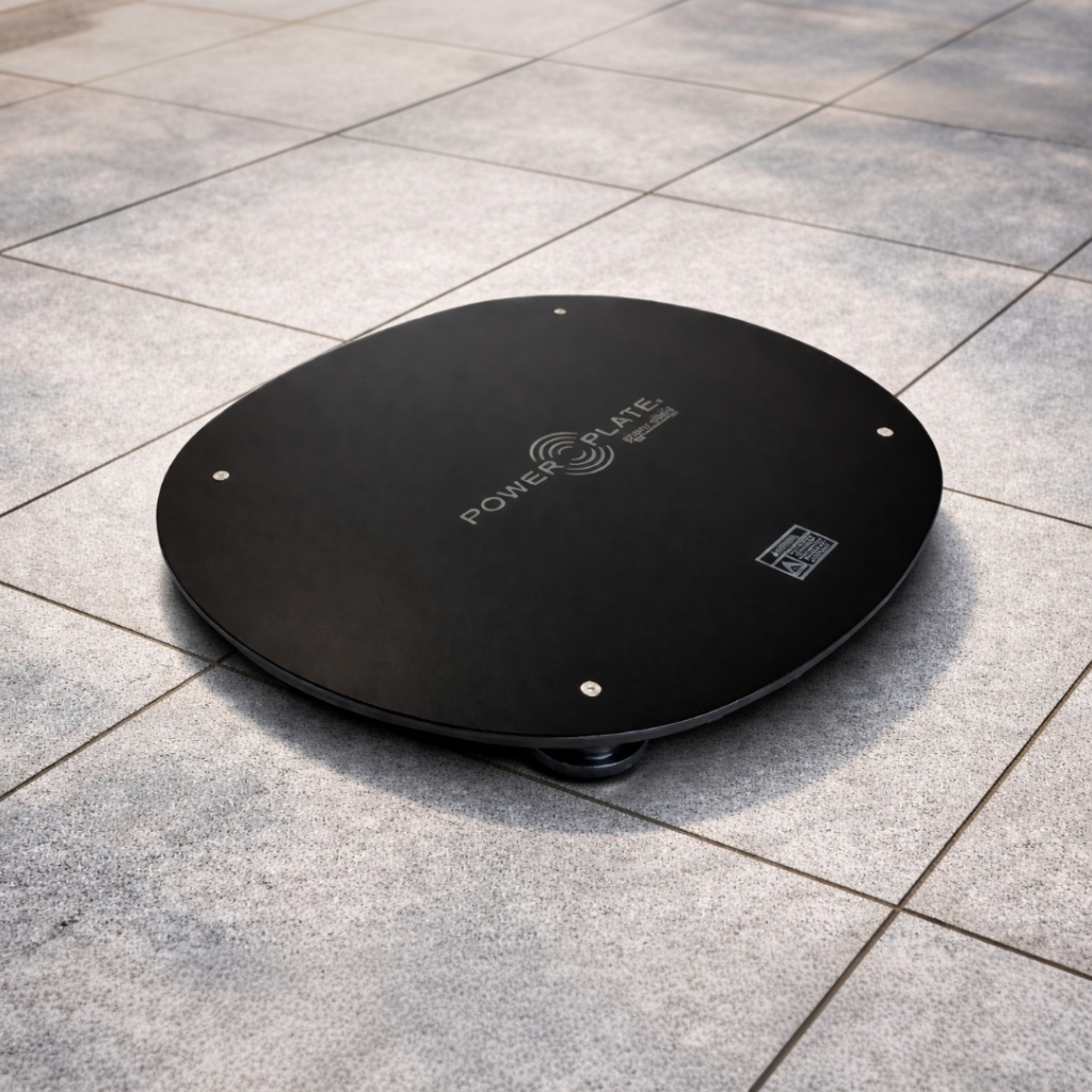 Power Plate MOVE Power Shield vibration dampening platform positioned on tile flooring to help minimize vibration transfer during whole body vibration training.