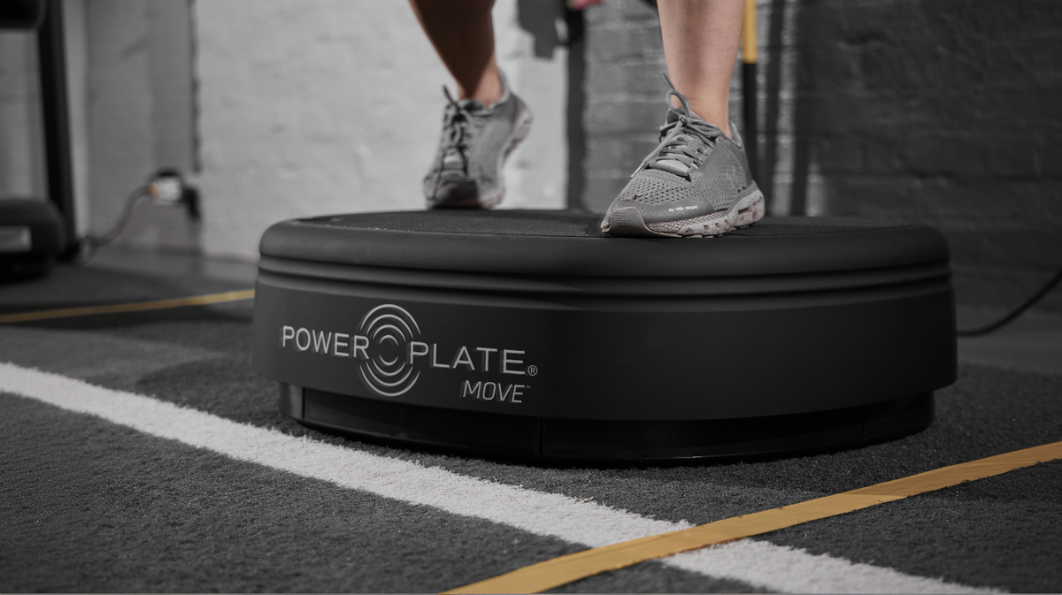 Close view of Power Plate MOVE whole body vibration platform showing textured training surface and stable base