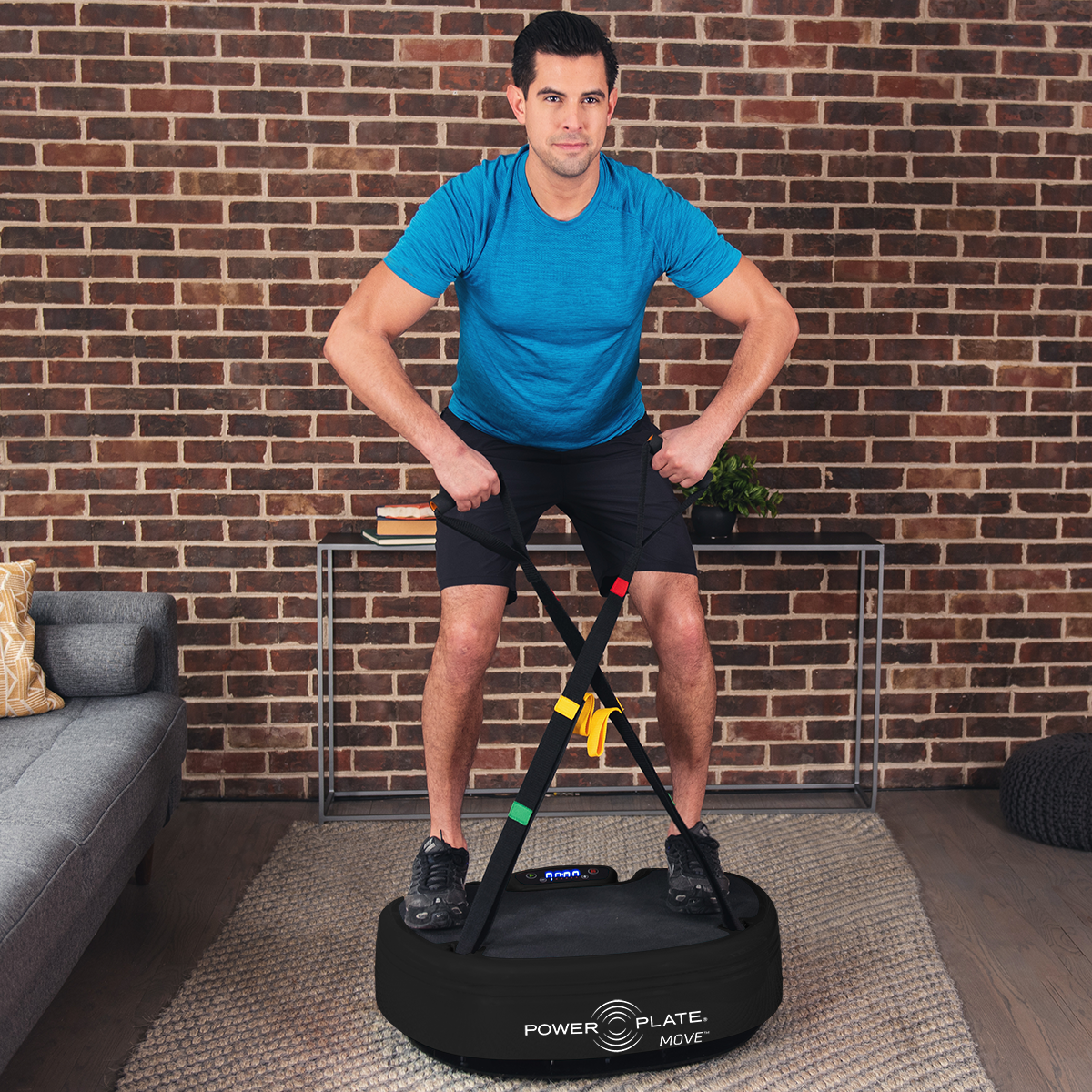 Power Plate MOVE whole body vibration platform in black finish shown in home gym setting