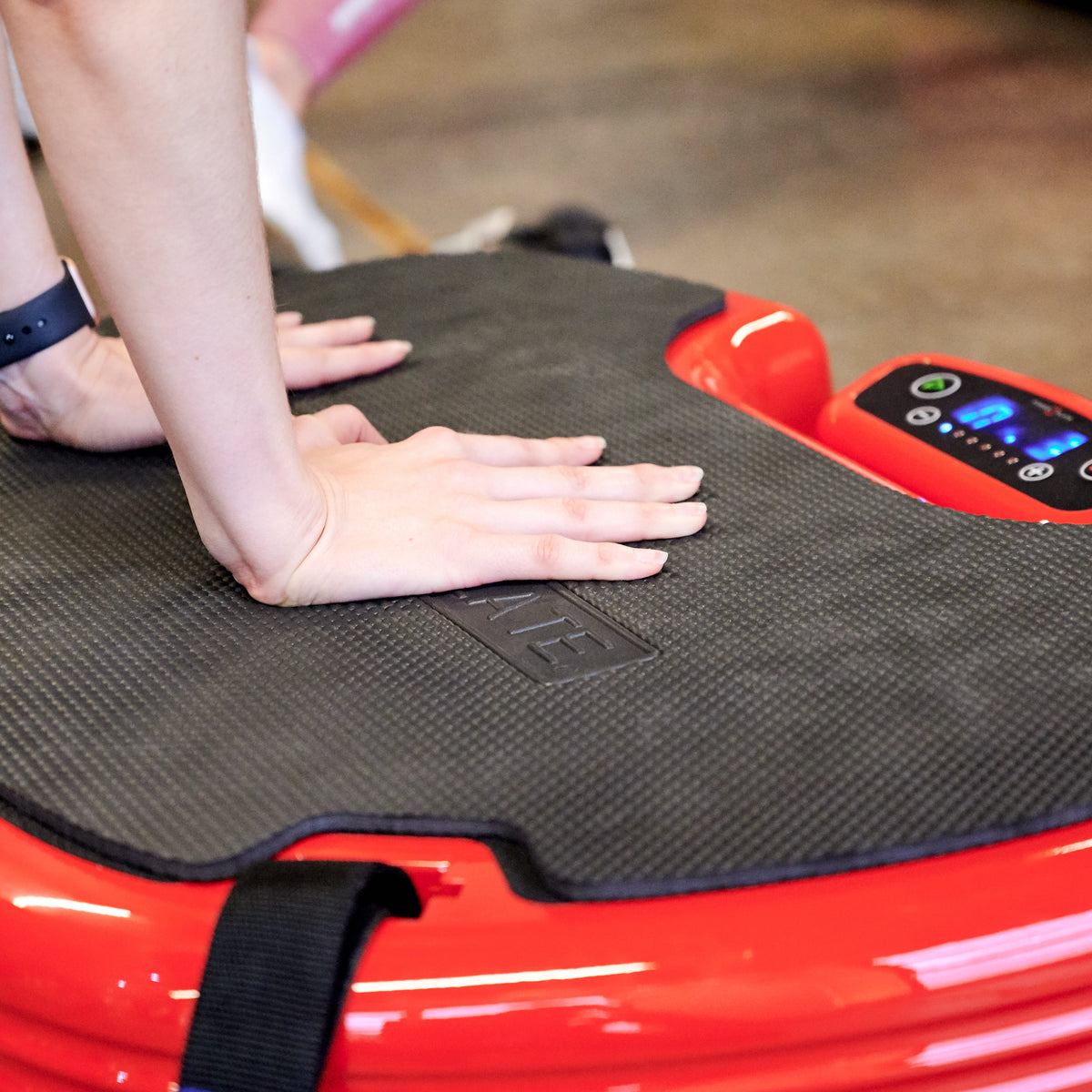 Close view of Power Plate MOVE whole body vibration platform showing textured surface and integrated control panel
