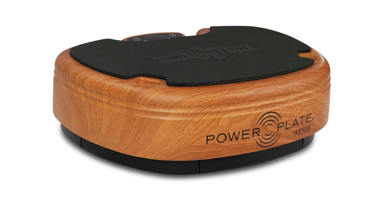 Power Plate MOVE whole body vibration platform shown in wood with integrated control panel and stable training 