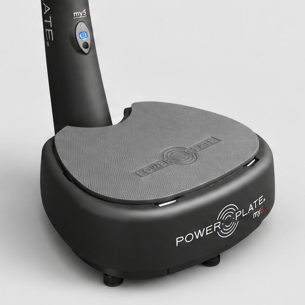 Power Plate my5 whole body vibration system platform close-up showing the textured vibration surface, lower control, and branded base.