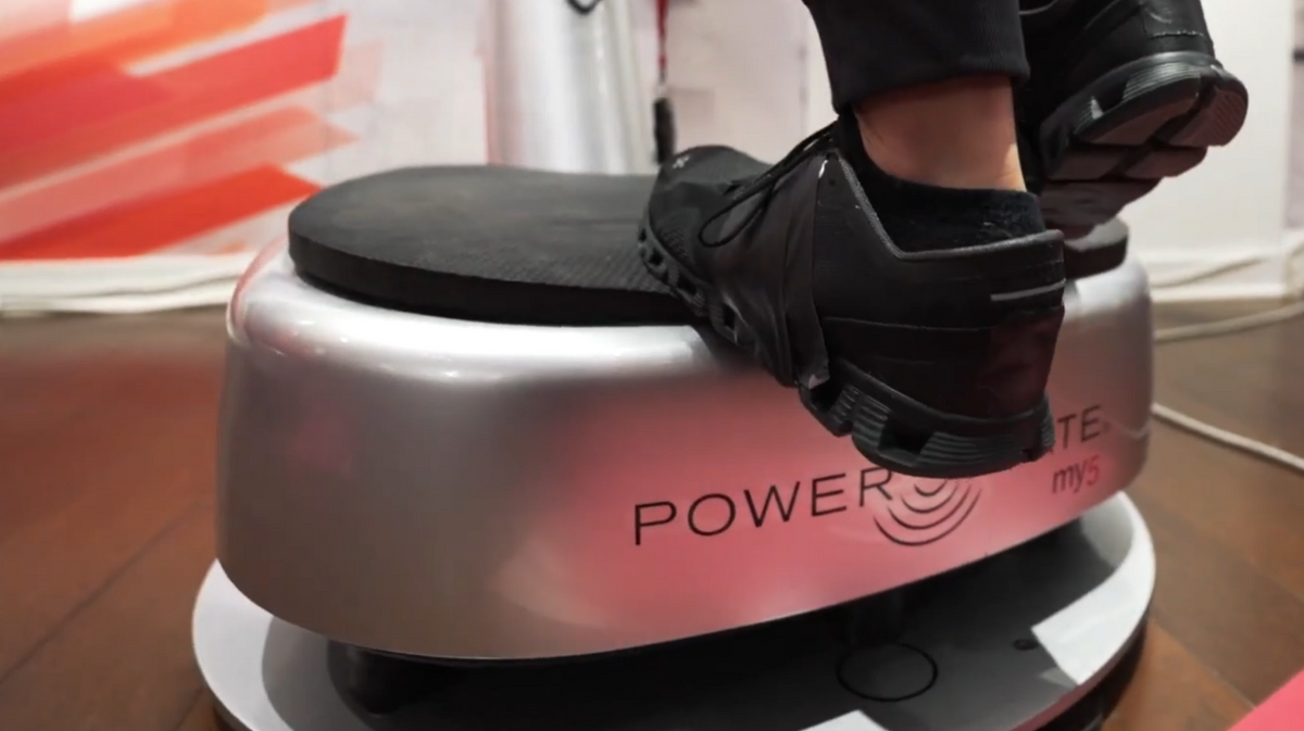 Power Plate my5 vibration training system operating on Power Shield vibration isolation platform base during whole body vibration exercise session