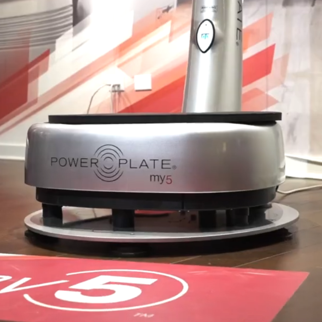 Power Plate my5 vibration training platform installed on Power Shield vibration isolation base during whole body vibration workout session