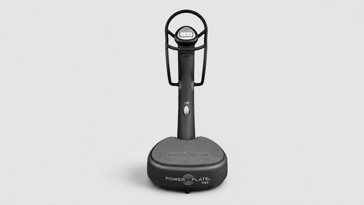 Power Plate my5 whole body vibration system shown from the front on a clean studio background with integrated handrails and touchscreen console.