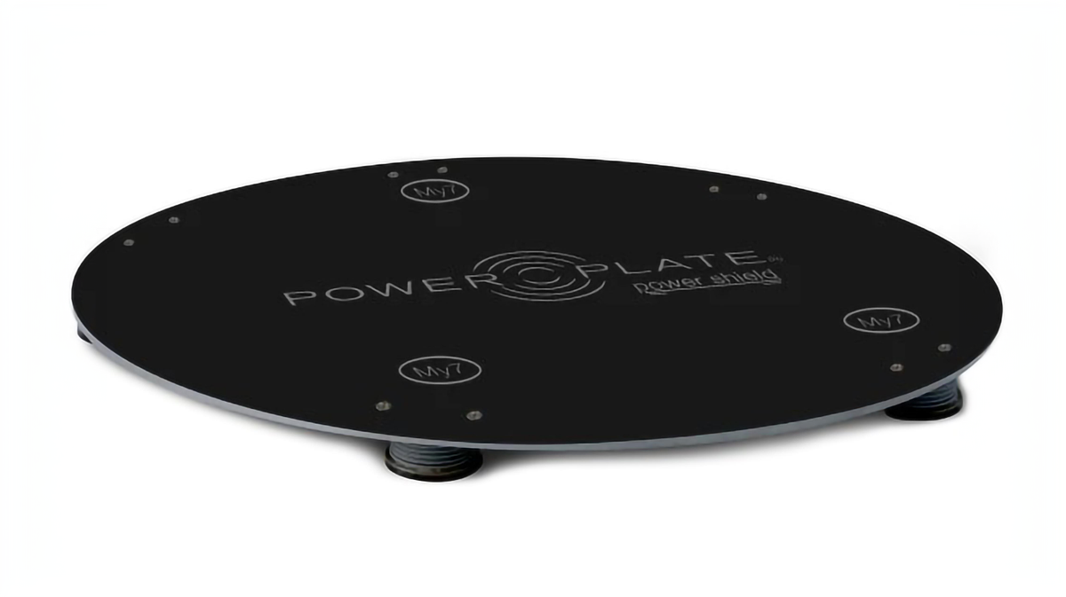 Rear view of Power Plate my7 positioned on Power Shield vibration reduction platform showing full base footprint and stable floor contact during training setup