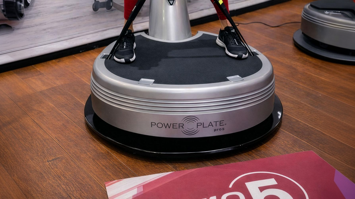 Power Plate pro5 vibration platform resting on Power Shield vibration reduction base designed to minimize vibration transfer to flooring