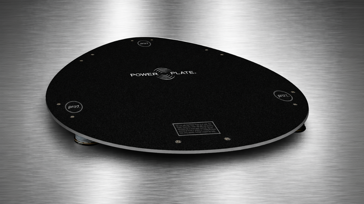 Power Plate pro7 pro8 Power Shield gloss black vibration reduction platform displayed on metallic background emphasizing structure and floor protection design