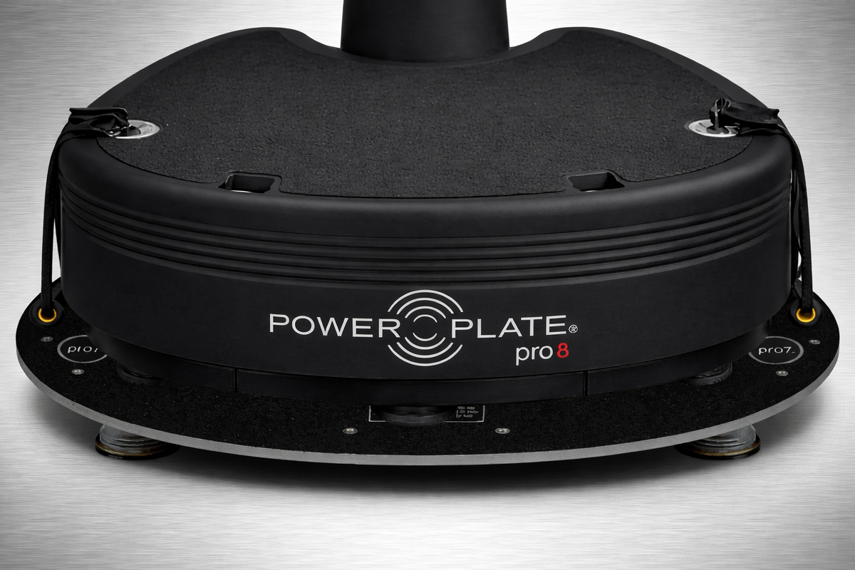 Power Plate pro8 vibration platform positioned on Power Shield base demonstrating vibration reduction setup and stable training platform on floor surface