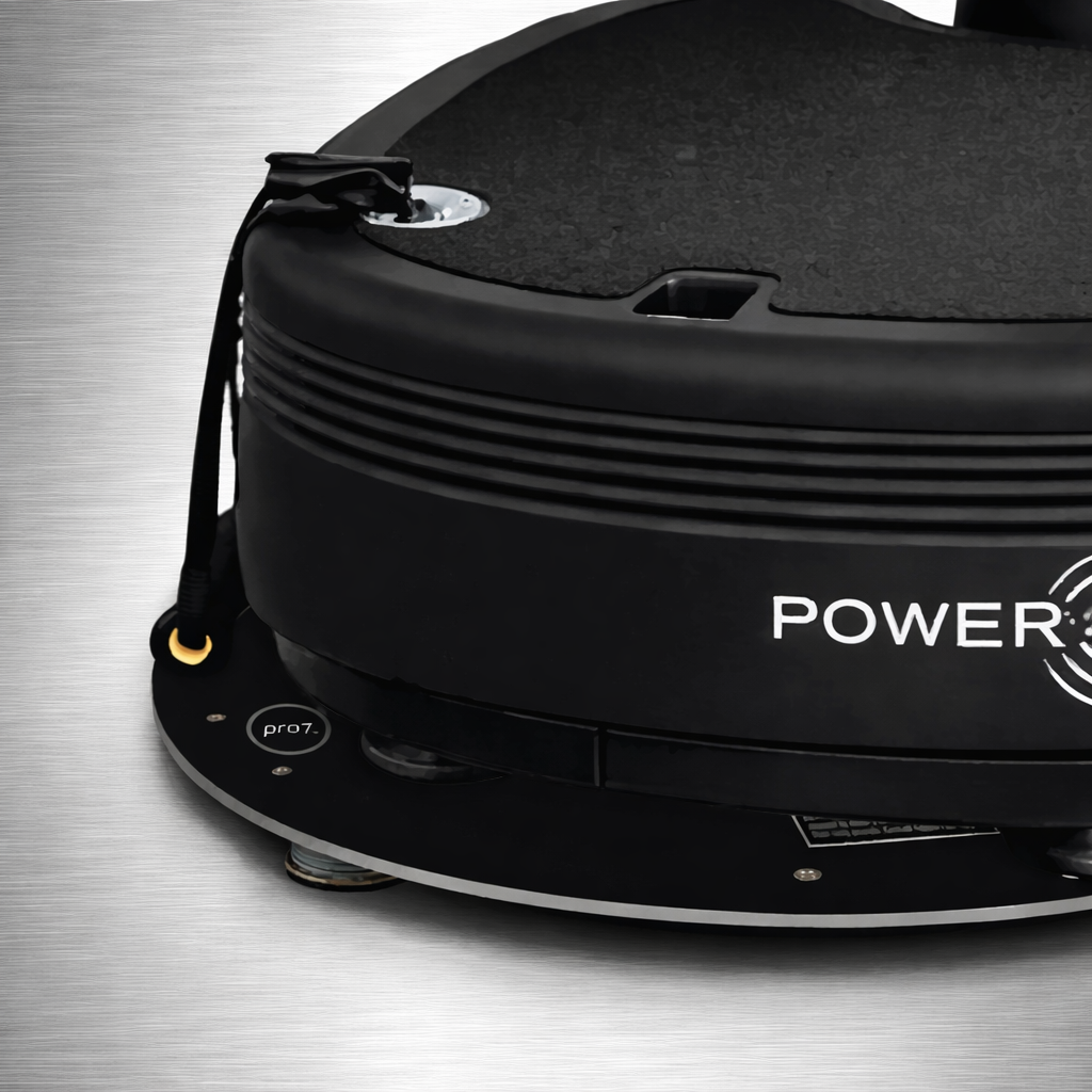 Close-up of Power Plate pro8 positioned on Power Shield base showing edge detail and vibration isolation components supporting reduced floor vibration transfer